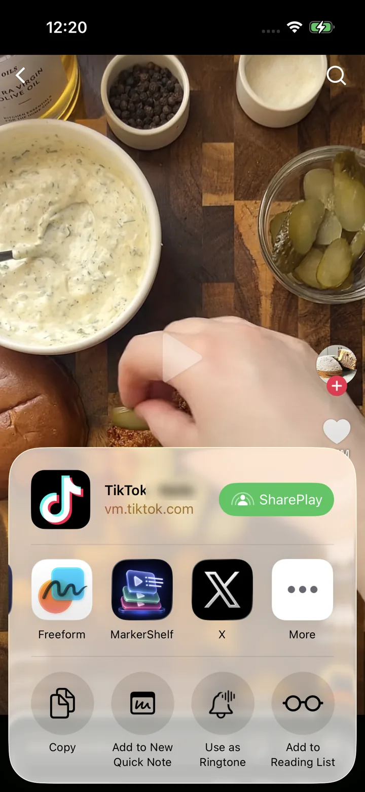 The iOS share sheet over a TikTok video with MarkerShelf as the destination